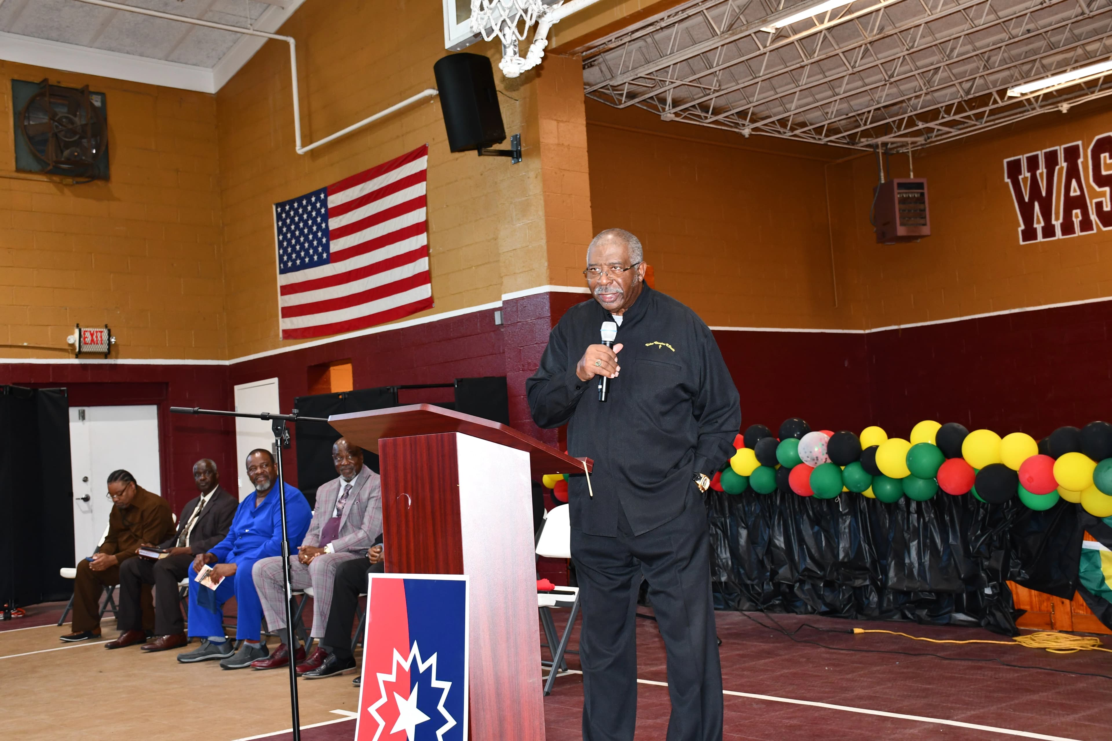 An elder addressing the crowd during the Juneteenth ceremony at Washington High School